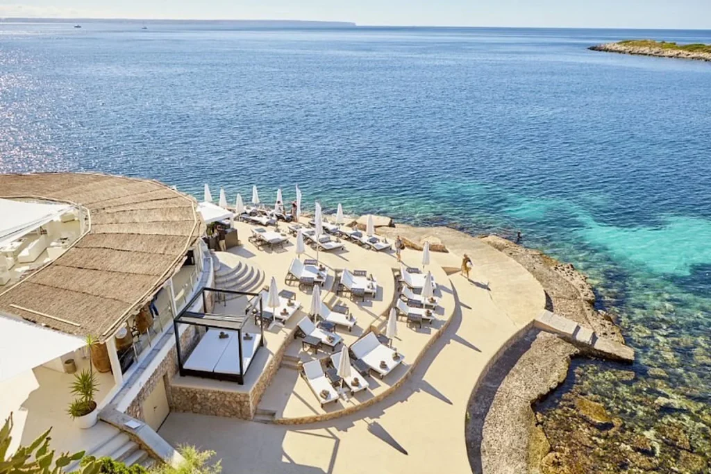 Seafront terrace with Mediterranean view at Puro Grand Hotel in Palma, Mallorca