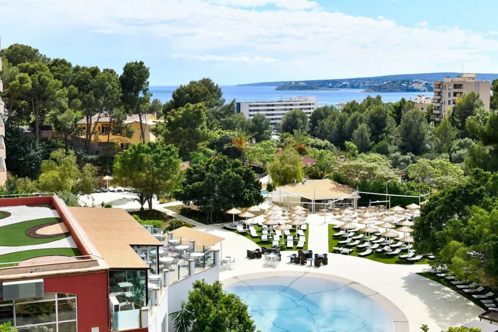 Pool and sunbathing area at Sallés Hotel Marina Portals in Portals Nous, Mallorca.