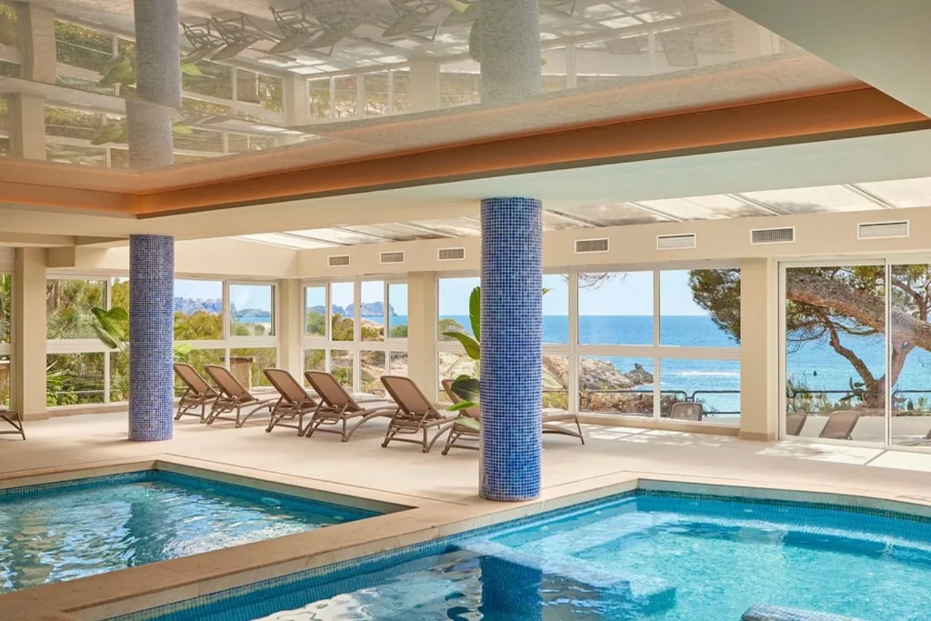Indoor spa pool with sea views at Universal Hotel Lido Park & Spa in Peguera, Majorca.