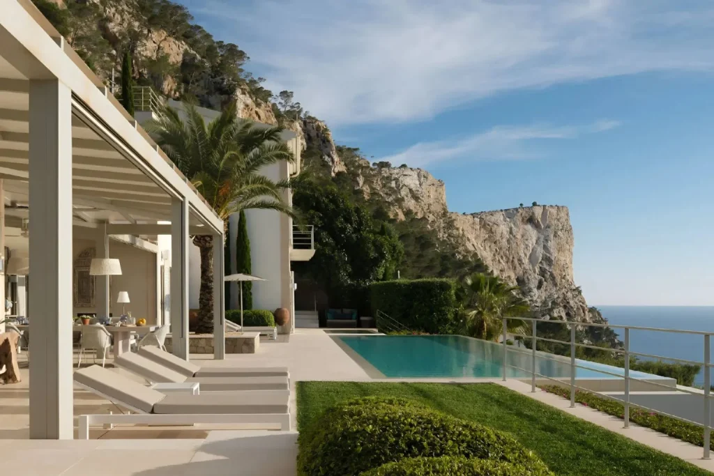 Infinity pool with views of the Mediterranean Sea and coastal cliffs at Villa Infinita in Port d'Andratx, Mallorca.