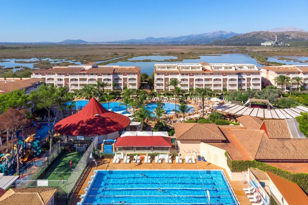 Aerial view of the swimming pools and family resort at Viva Blue & Spa in Playa de Muro, Majorca.
