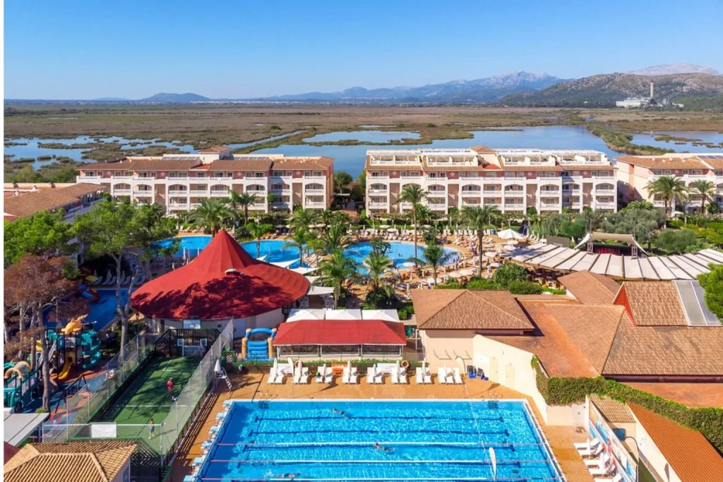 Aerial view of resort swimming pools at VIVA Blue & Spa in Playa de Muro, Mallorca