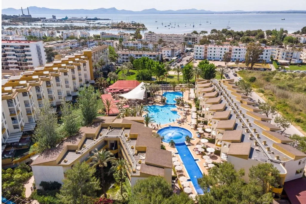 Aerial view of resort swimming pools at Zafiro Hotels with Cycling Station in Port d'Alcúdia, Mallorca