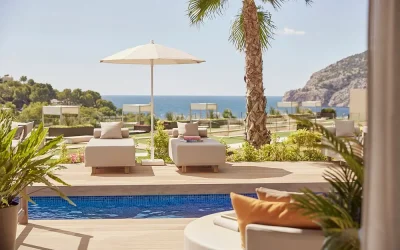 Poolside cabanas with Mediterranean sea views at Zafiro Palace Andratx in Camp de Mar, Majorca.